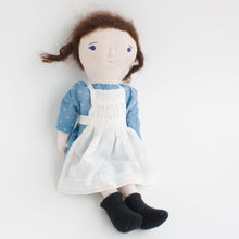 primitive doll with brown pigtails
