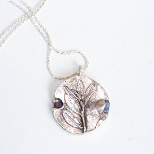 leaf necklace with raw sapphire and ruby