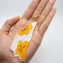 orange half flower on white background - beadwork earrings